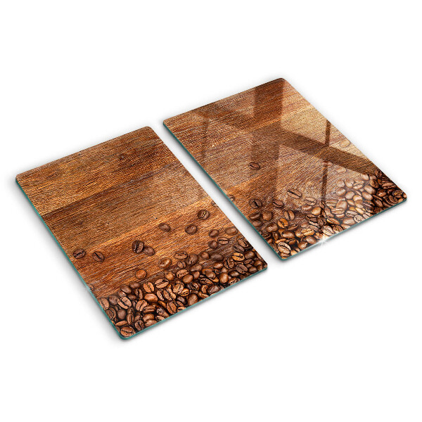 Chopping board glass Coffee beans on a wooden background
