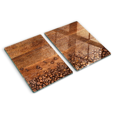 Chopping board glass Coffee beans on a wooden background