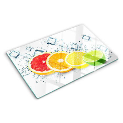 Glass chopping board Citrus fruits in colorful slices