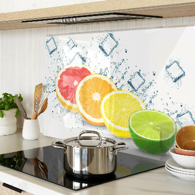 Glass chopping board Citrus fruits in colorful slices