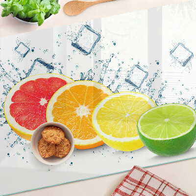 Glass chopping board Citrus fruits in colorful slices