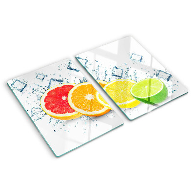 Glass chopping board Citrus fruits in colorful slices