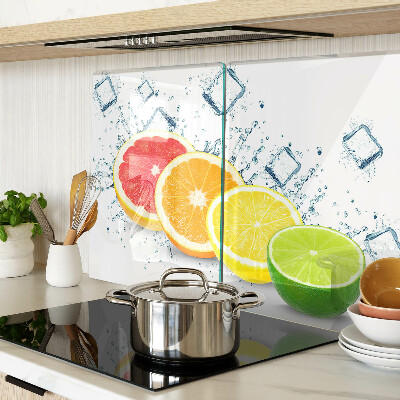Glass chopping board Citrus fruits in colorful slices