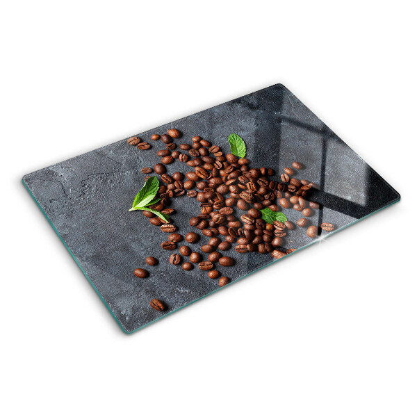 Chopping board glass Coffee beans on a stone background