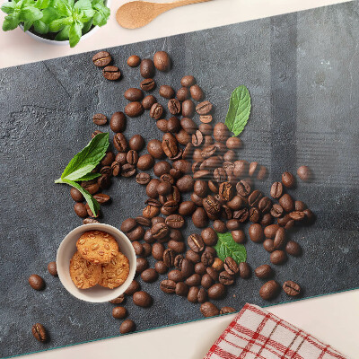 Chopping board glass Coffee beans on a stone background
