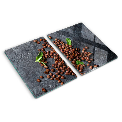 Chopping board glass Coffee beans on a stone background