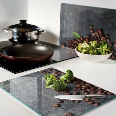 Chopping board glass Coffee beans on a stone background