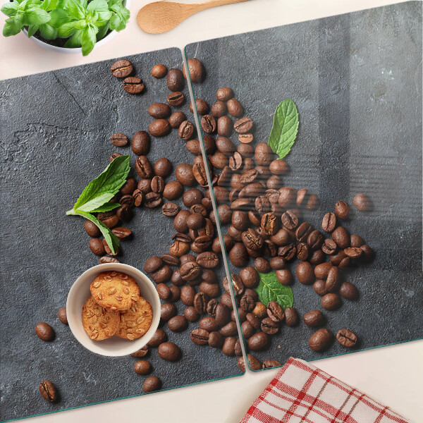 Chopping board glass Coffee beans on a stone background