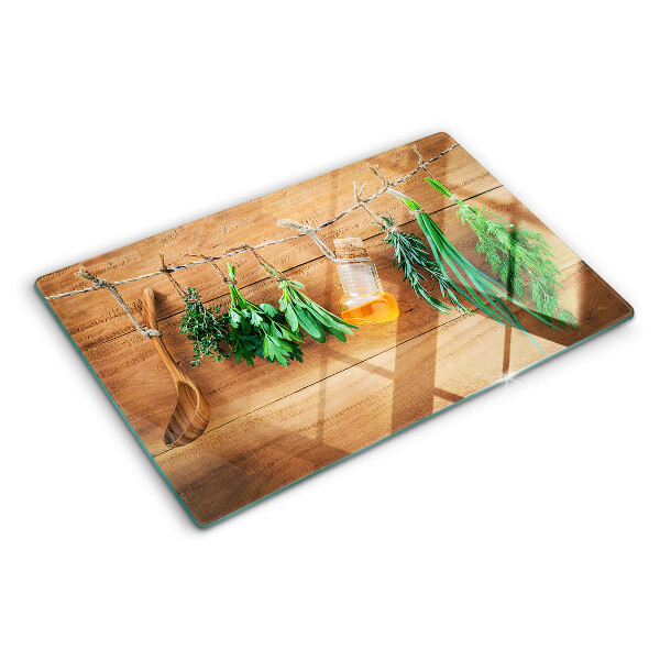 Glass chopping board Herbs in the kitchen