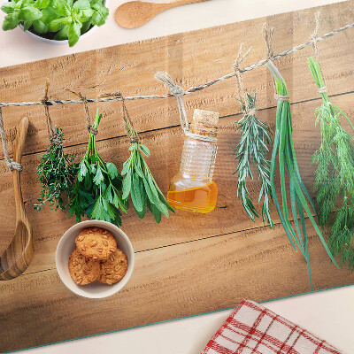 Glass chopping board Herbs in the kitchen