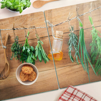 Glass chopping board Herbs in the kitchen