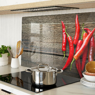 Chopping board Chili peppers on a wooden background