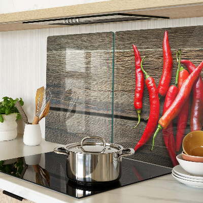 Chopping board Chili peppers on a wooden background