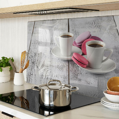 Cutting board Coffee and macaroons on a wooden background