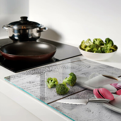 Cutting board Coffee and macaroons on a wooden background