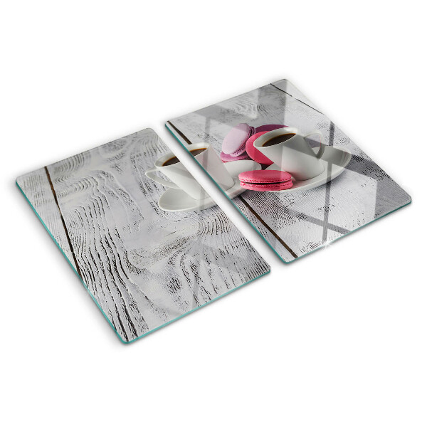 Cutting board Coffee and macaroons on a wooden background