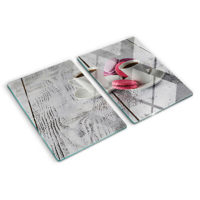 Cutting board Coffee and macaroons on a wooden background