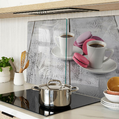 Cutting board Coffee and macaroons on a wooden background