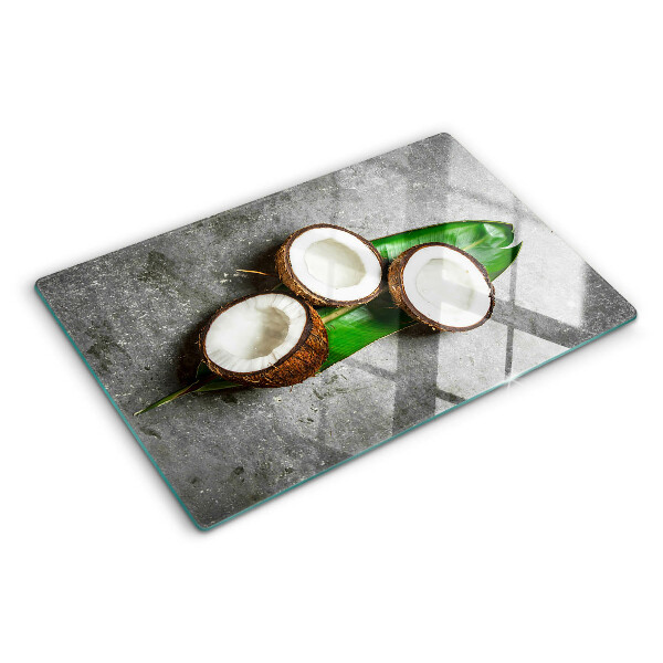 Glass chopping board Coconut on a concrete background