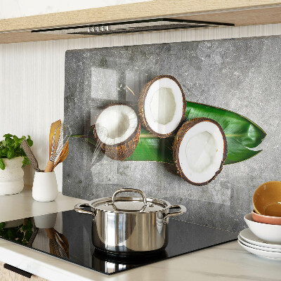 Glass chopping board Coconut on a concrete background