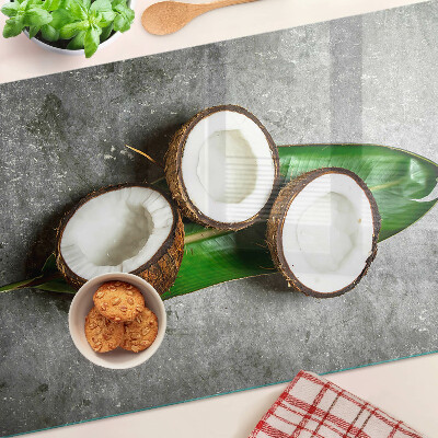 Glass chopping board Coconut on a concrete background