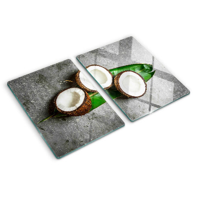 Glass chopping board Coconut on a concrete background