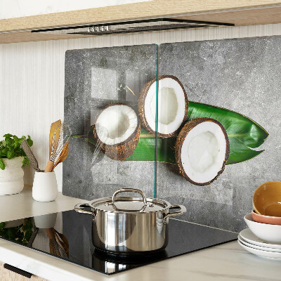 Glass chopping board Coconut on a concrete background