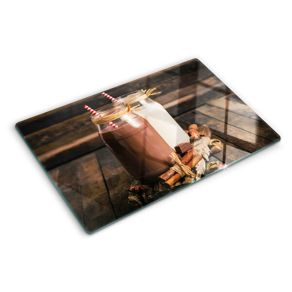 Glass chopping board Jars of drinks on a wooden background