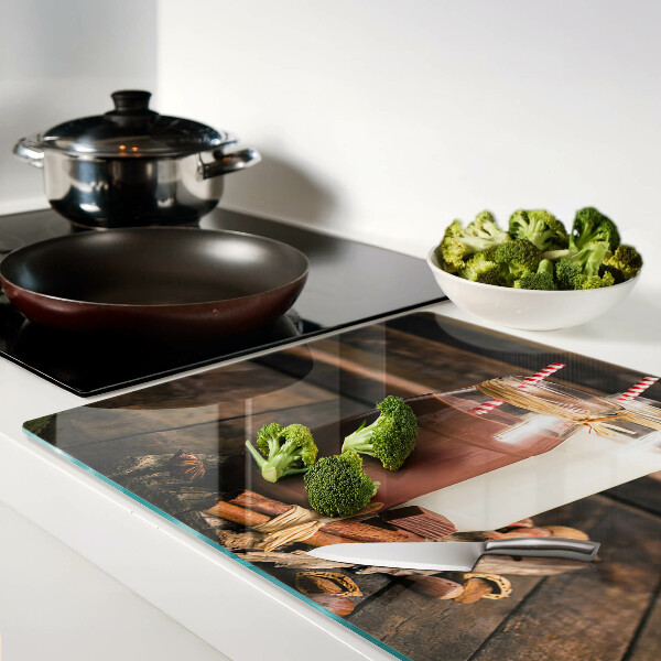 Glass chopping board Jars of drinks on a wooden background