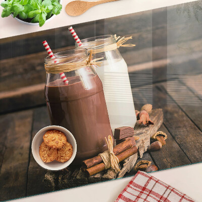 Glass chopping board Jars of drinks on a wooden background