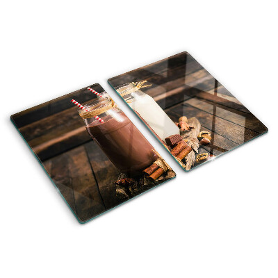 Glass chopping board Jars of drinks on a wooden background