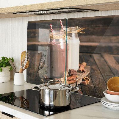 Glass chopping board Jars of drinks on a wooden background