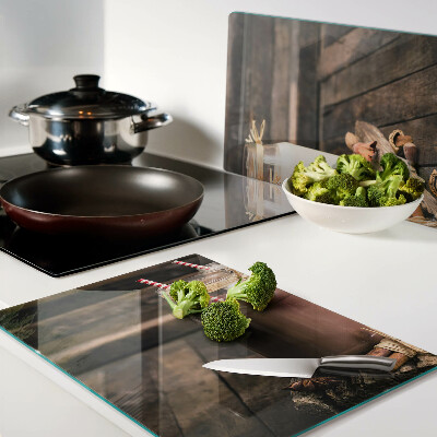 Glass chopping board Jars of drinks on a wooden background