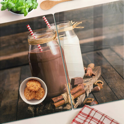 Glass chopping board Jars of drinks on a wooden background