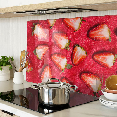 Chopping board glass Strawberries on a pink background