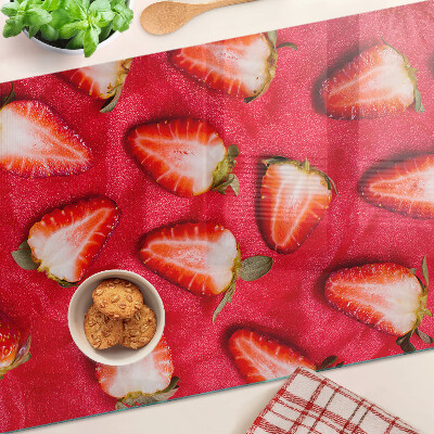 Chopping board glass Strawberries on a pink background