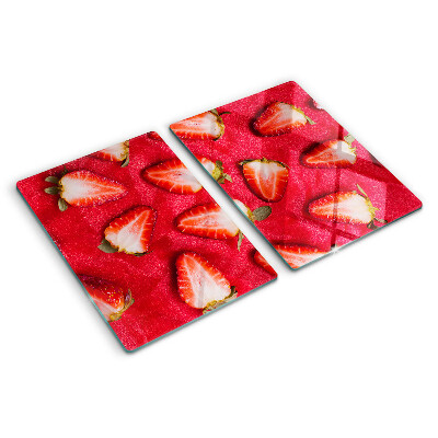 Chopping board glass Strawberries on a pink background