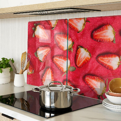 Chopping board glass Strawberries on a pink background