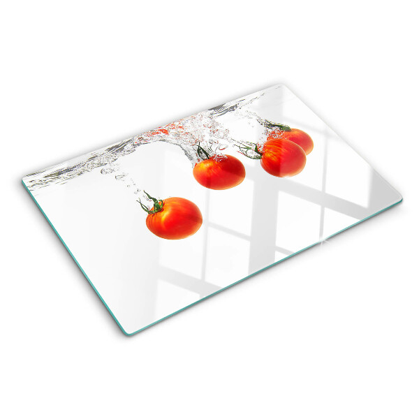 Glass chopping board Tomatoes in water