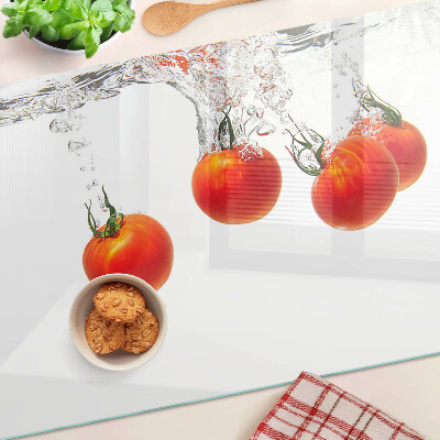 Glass chopping board Tomatoes in water