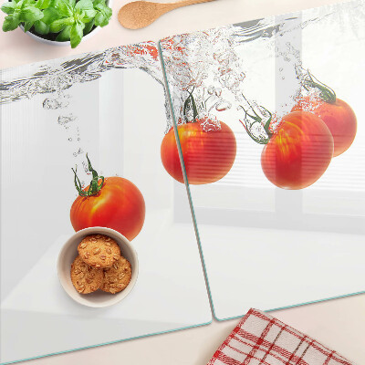 Glass chopping board Tomatoes in water
