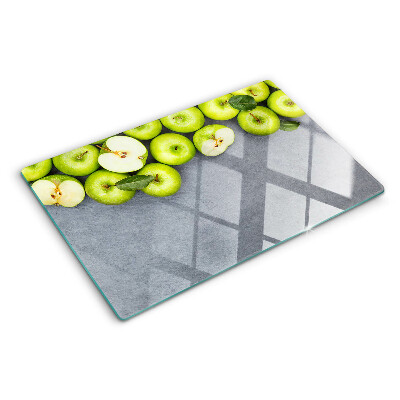Cutting board Green apples on a gray surface