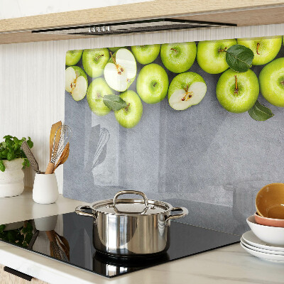 Cutting board Green apples on a gray surface