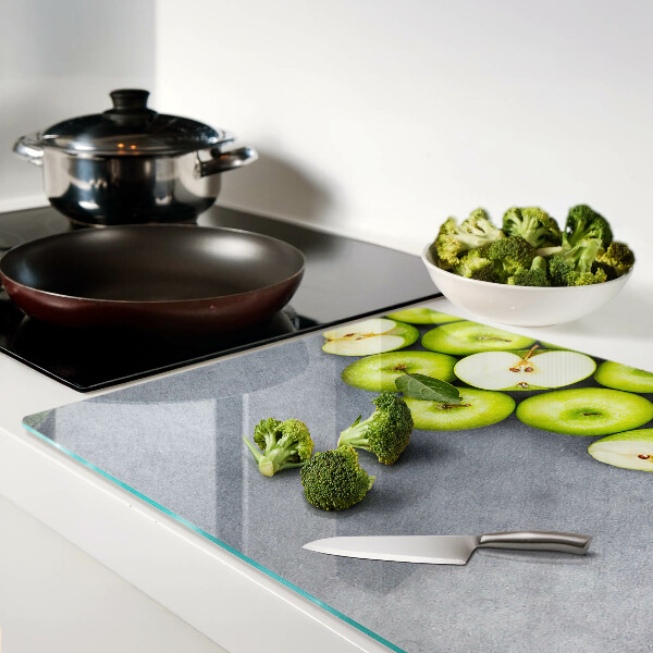 Cutting board Green apples on a gray surface