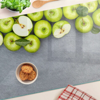 Cutting board Green apples on a gray surface