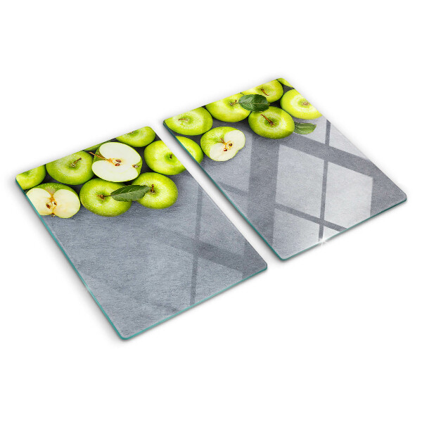 Cutting board Green apples on a gray surface