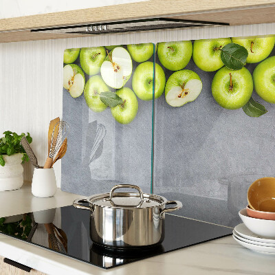 Cutting board Green apples on a gray surface