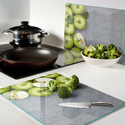 Cutting board Green apples on a gray surface