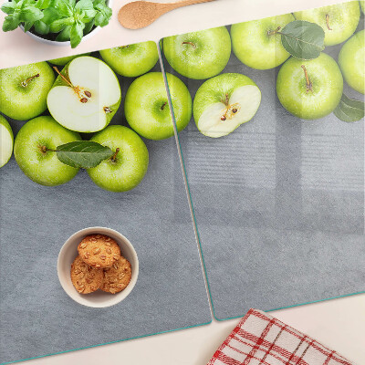 Cutting board Green apples on a gray surface
