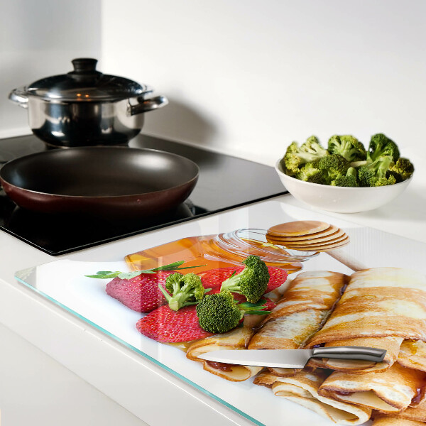 Glass cutting board Pancakes with honey and strawberries